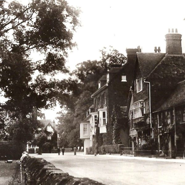 A historical black and white photo of Salisbury Cathedral Close.