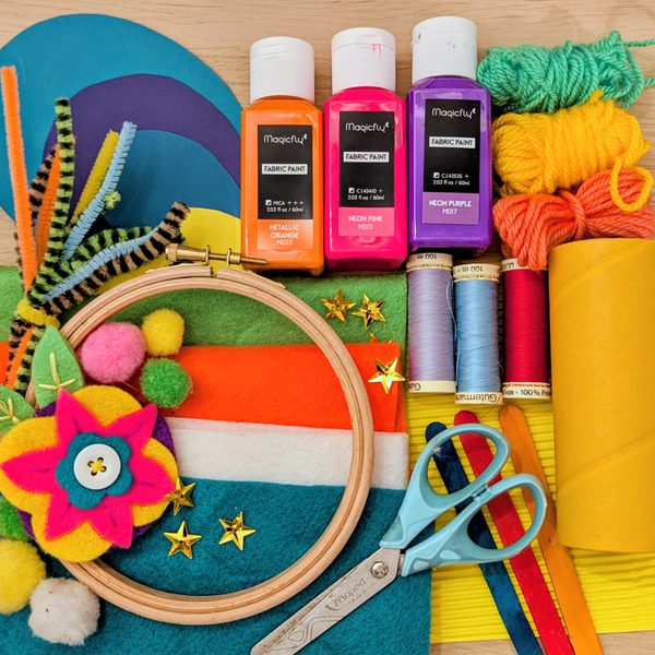 A set of colourful craft supplies laid out on a table.