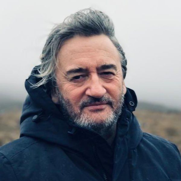 Journalist Fergal Keane in an outdoor coat on a windy day.